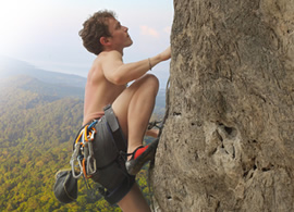 Young male rock climber